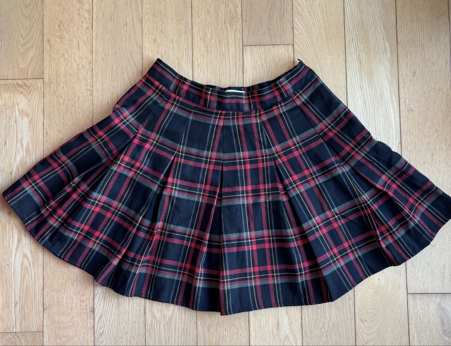 Mini saia com pregas e xadrez. Pull and Bear