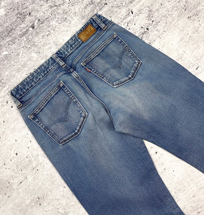 Spodnie jeansowe LEVIS 553 Mid-Rise Boot dzwony damskie szerokie W29