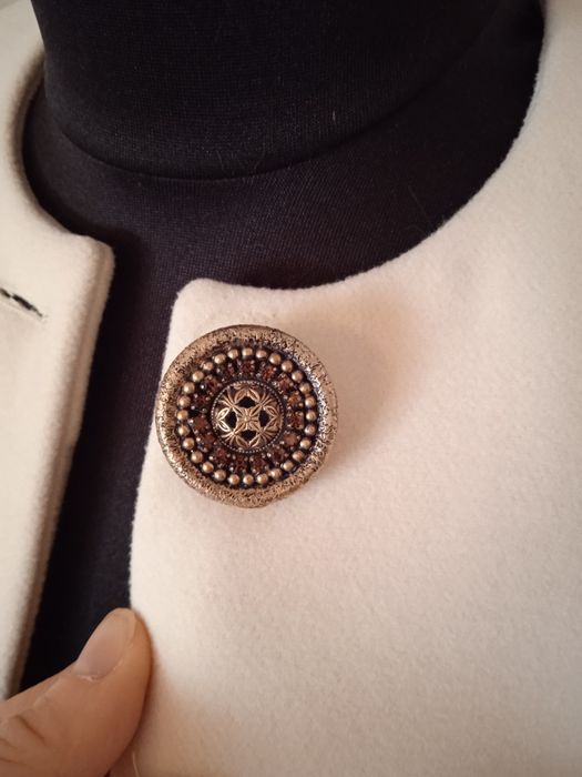 Жіноче пальто молочне