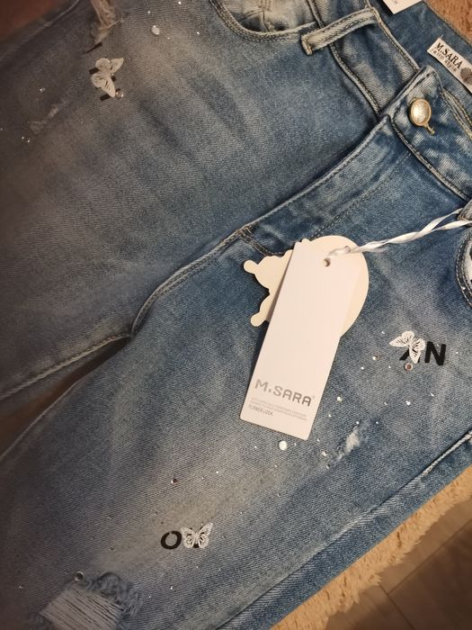 Nowe spodnie niebieskie M Sara 31 push up cekiny motyle
