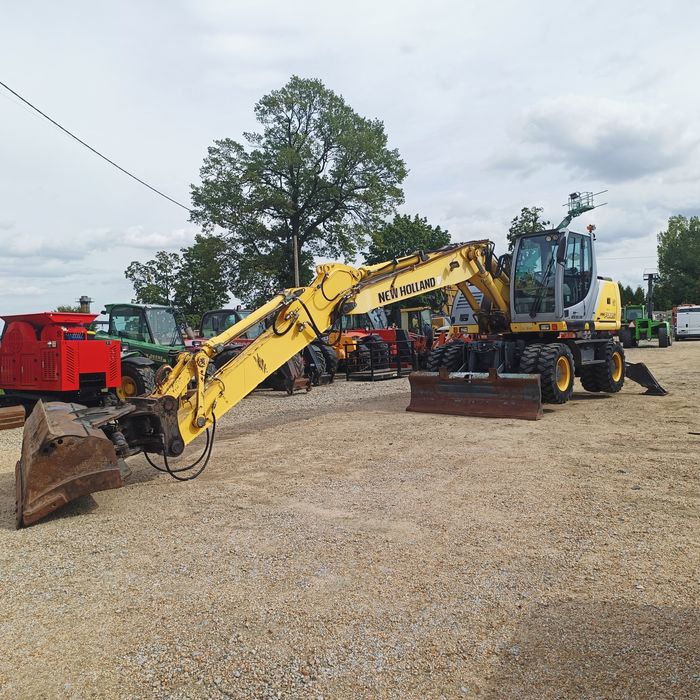 Maszyna budowlana koparka New Holland MH Plus  Ramie LONG