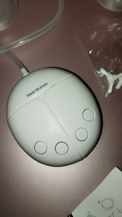 Bomba extratora de leite materno elétrica e conchas para seios