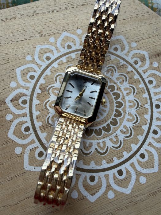 Relogio dourado senhora