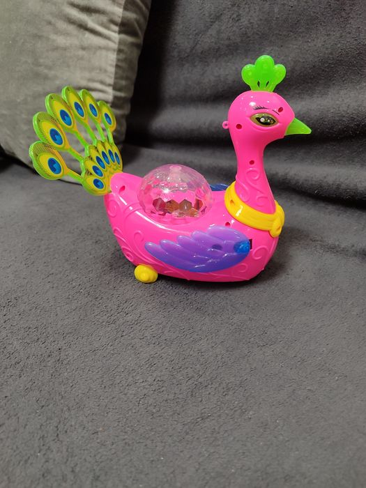 Жарптиця іграшка що їздить і світиться