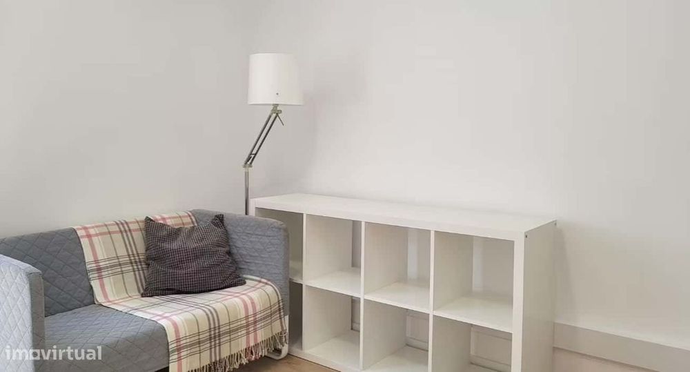 Superior room with shared bathroom and a sofa