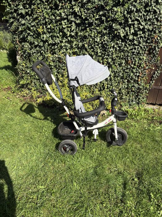 Szary trójkołowy rowerek z daszkiem