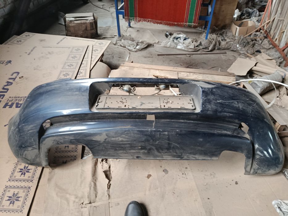 Бампер задний на Мазда 323ф