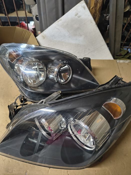 Lampy przednie Opel Astra H europa Hella