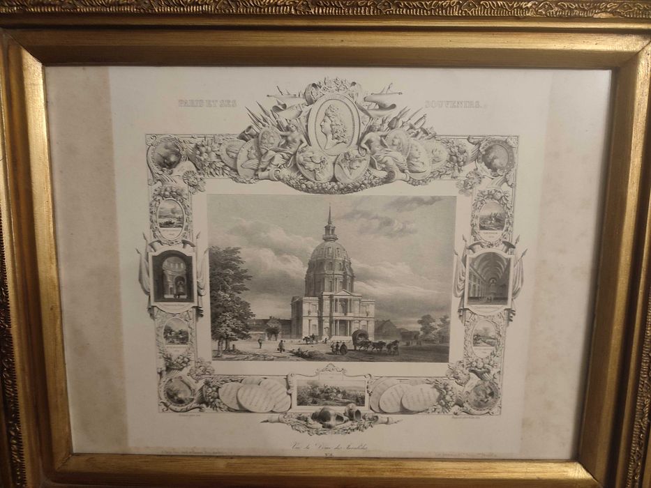 Quadro com gravura antiga e moldura dourada.