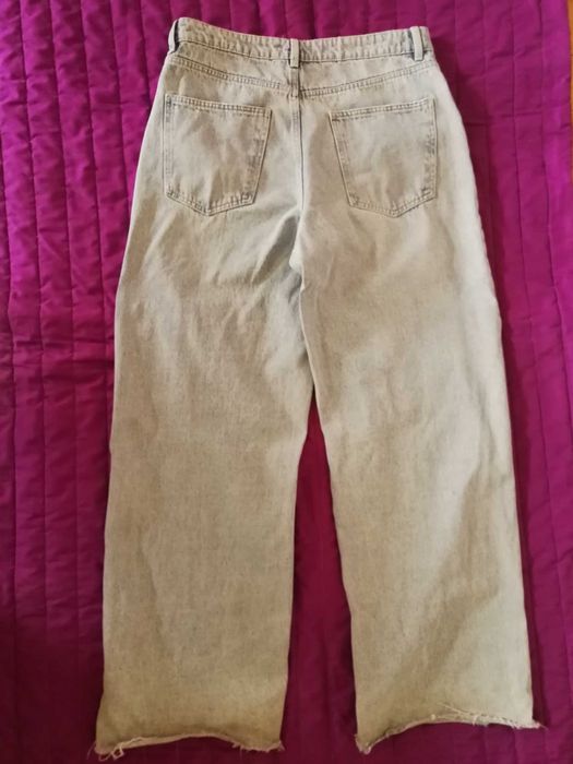 damskie jeansy z dziurami wide leg Sinsay 42