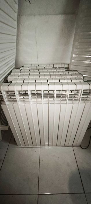 Caldeira a gás, radiadores, toalheiros e válvulas termostáticas Roca