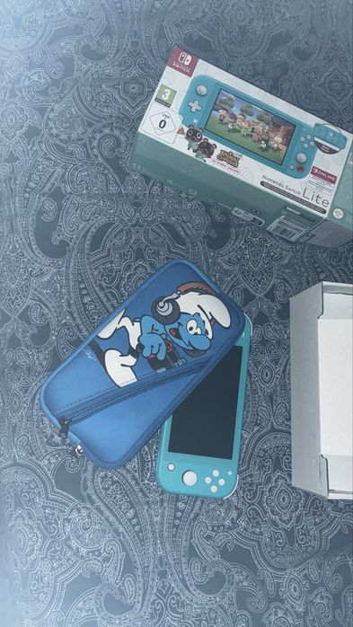 Consola Nintendo Switch lite turquesa com mala