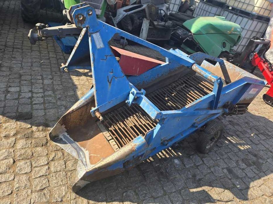 Arrancador de batata de tapete com descarga lateral - usado