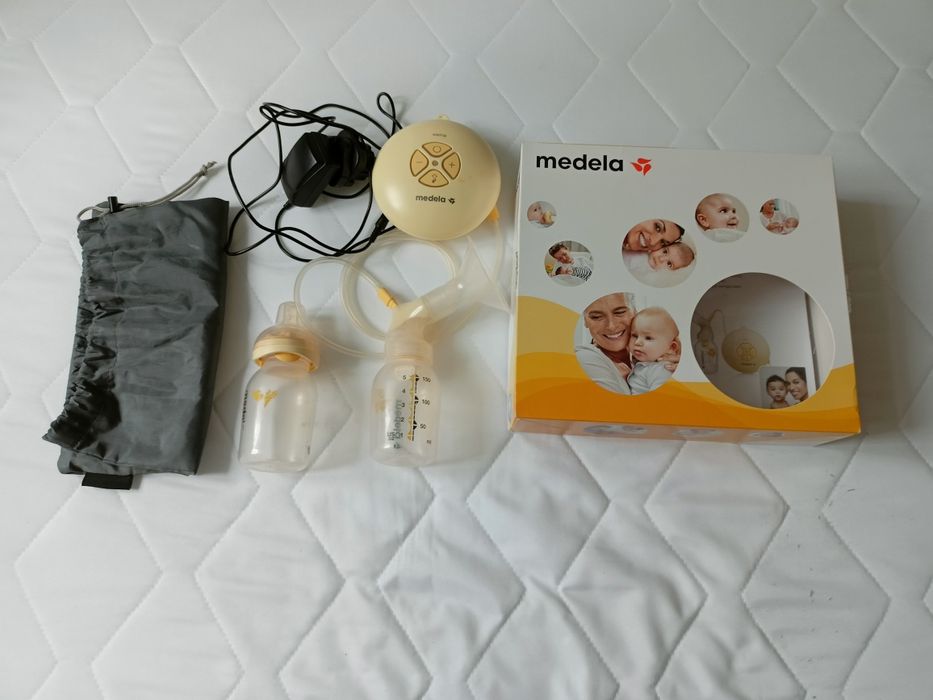 Laktator Medela swing +butelka calma + butelki przechowywanie