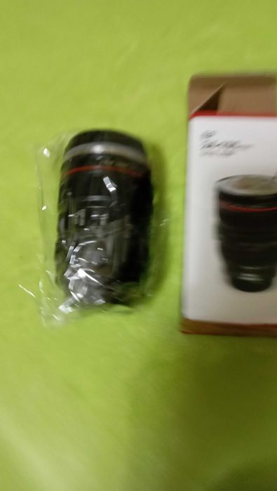 Caneca em forma de lente fotográfica