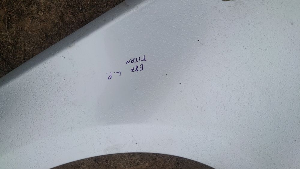 BMW e87 e81 błotnik lewy przód titansilber