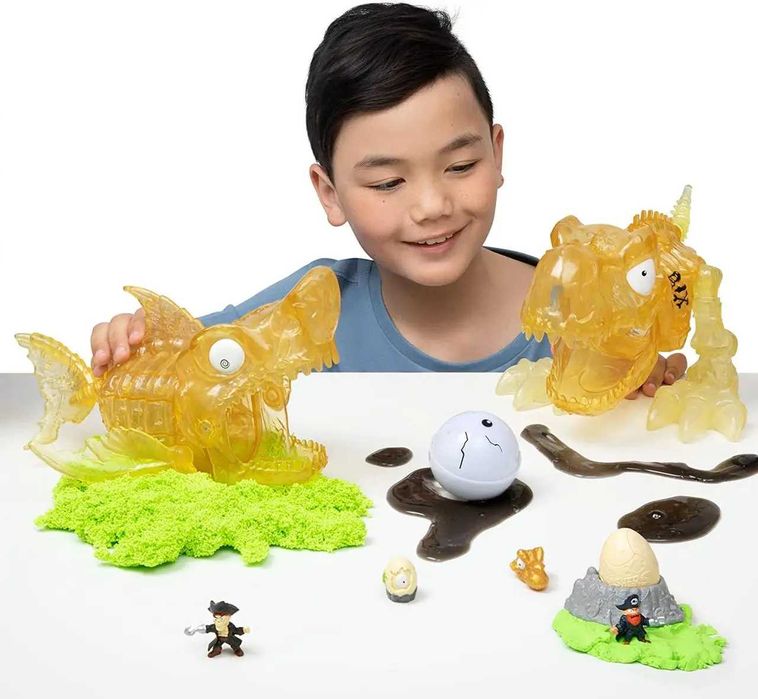 Динозавр Трекс в черепе с песком и 30 сюрпризов Smashers Dino Island