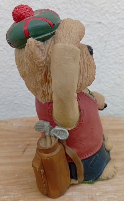 Estatueta de um cão golfista