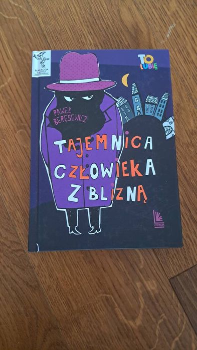 Książka pt „ tajemnica człowieka z blizną „