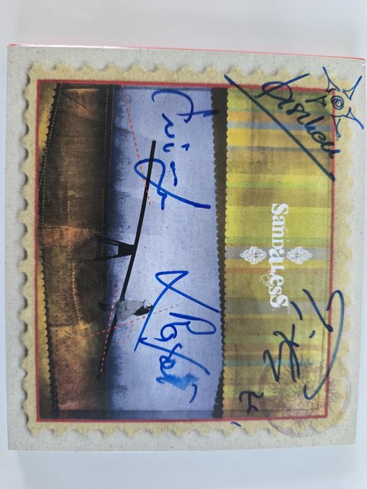 Sandaless z autografem