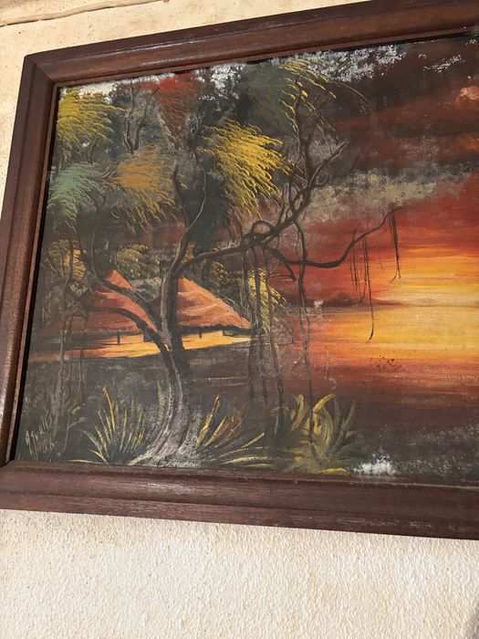 Quadro decorativo com uma pintura de uma paisagem tropical ao pôr do sol, semelhante a obras de arte de ilhas tropicais com palmeiras e barcos