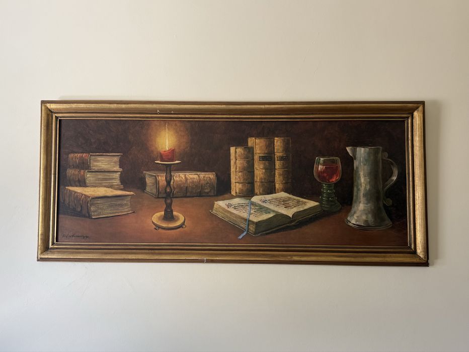 Quadro com pintura de livros e vela