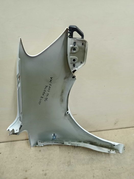 VW Caddy Touran 1 3 lift 2014r. błotnik lewy przód przedni biały