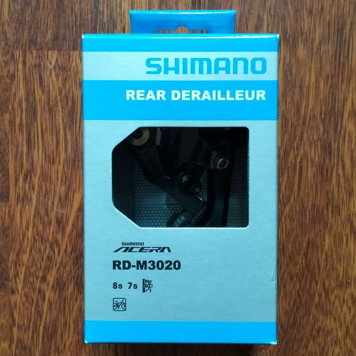 Задній перемикач Shimano Deore; SLX;(ХТ) 7--12 швидкостей