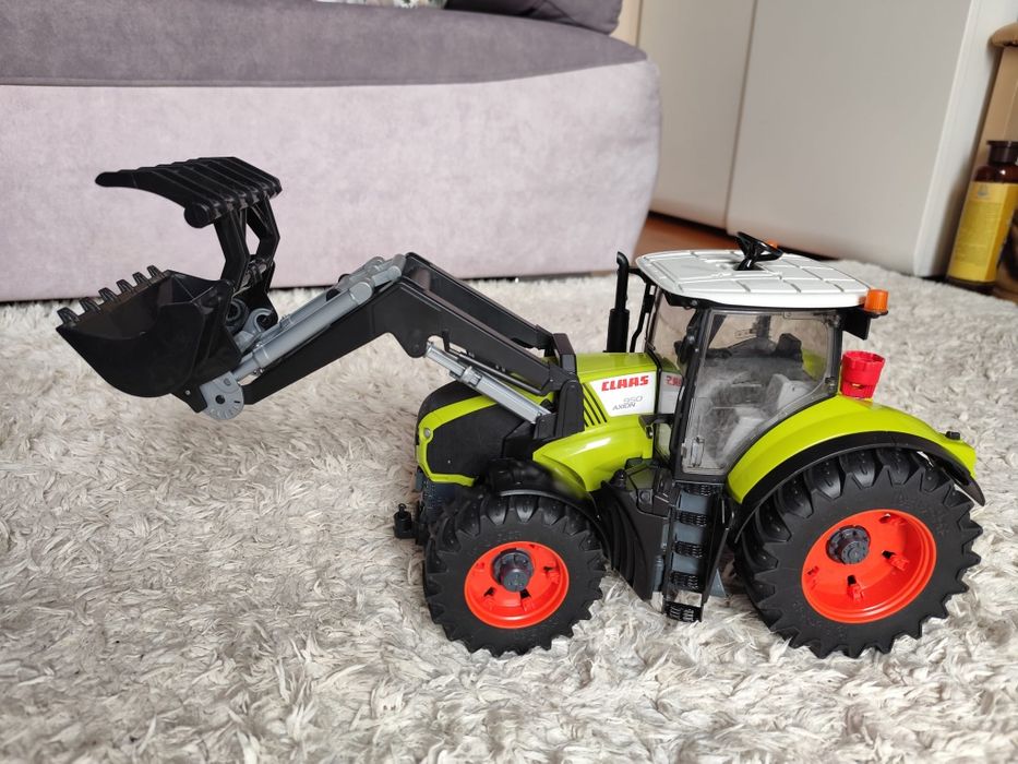 Bruder class axion 950 z ładowaczem jak nowy