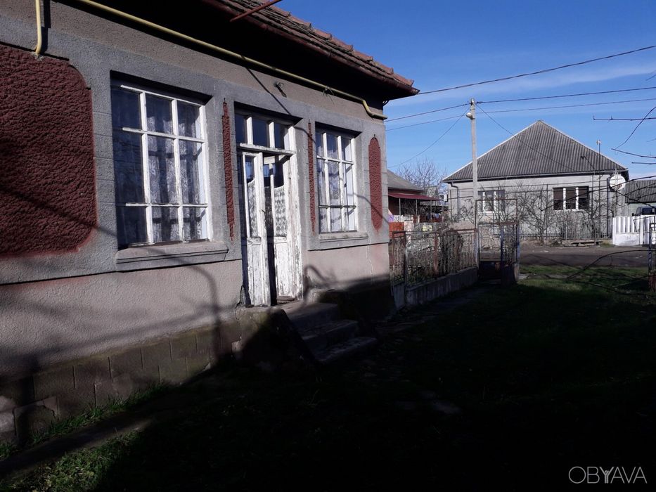 Будинок та земельна ділянка