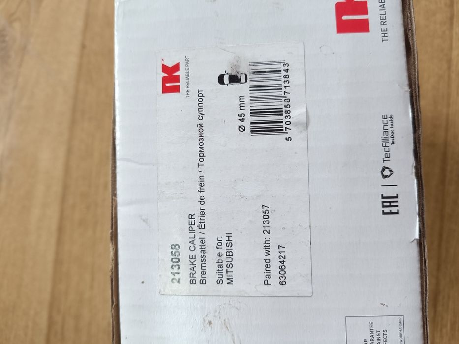 Гальмівний супорт передній правий NK 213058  Mitsubishi Pajero III -IV