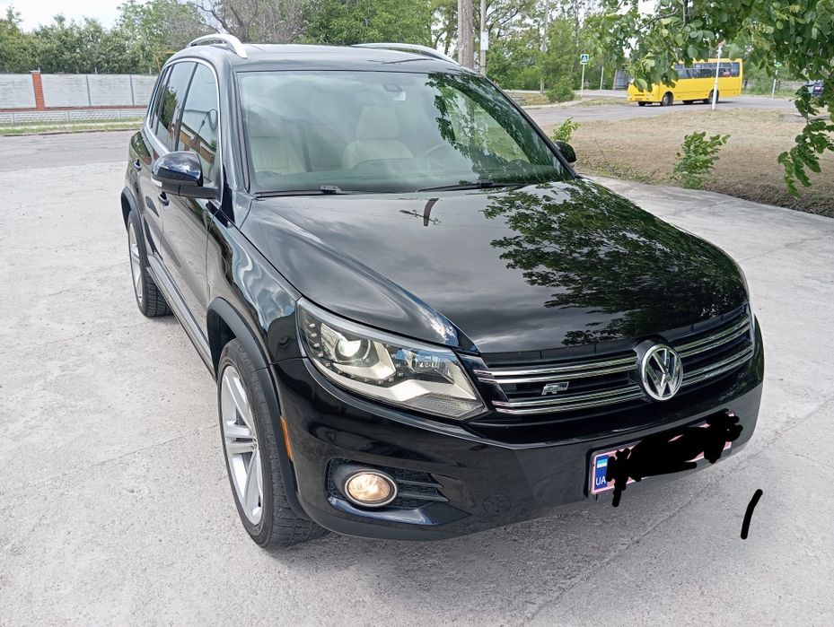Volkswagen Tiguan 2014 VIN WVGAV7AX4FW009831 фото оголошення 3 з 24