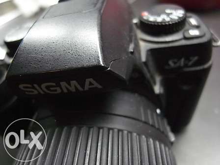 Máquina fotográfica Sigma SA7 reflex lente 28-70