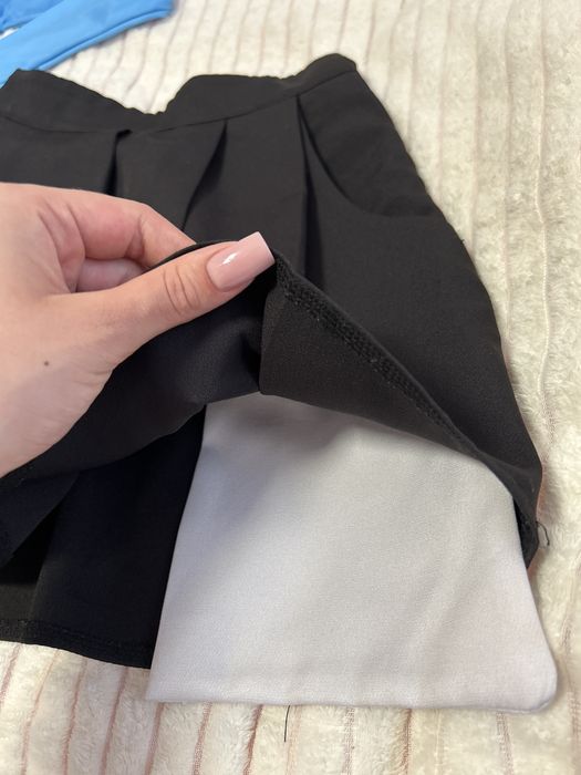 Спілниця та топ костюм