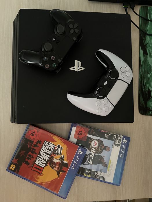 PlayStation 4 PRO 1TB + 2 PADA + 2 Gry RDR2 i UFC