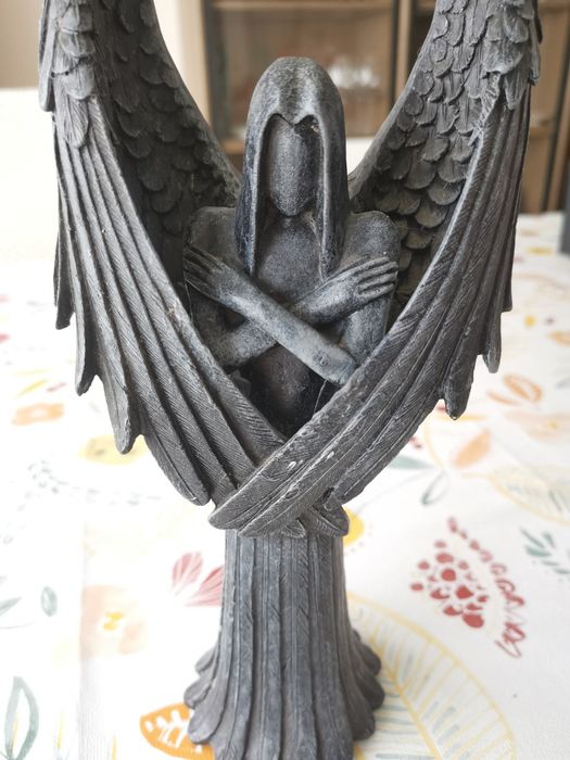 Black angel figurine made of porcelain