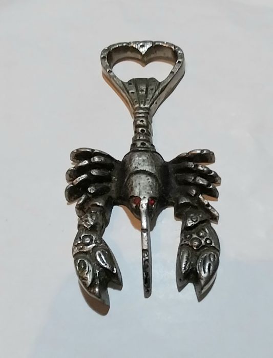 Abre cápsulas antigo em metal