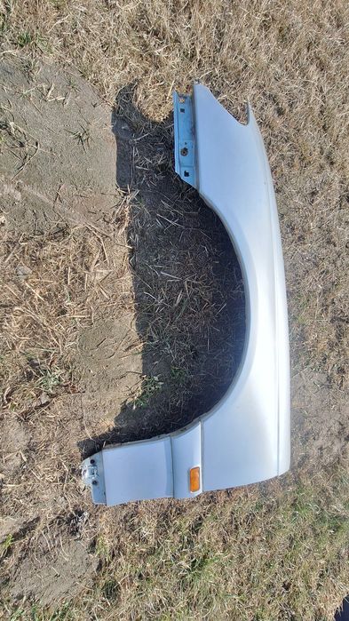 Błotnik lewy Opel Omega B FL Z147 srebrny