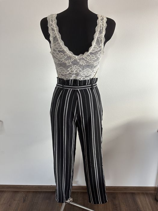 Spodnie zwiewne wiązanie kokardka pionowe paski czarne kuloty na lato