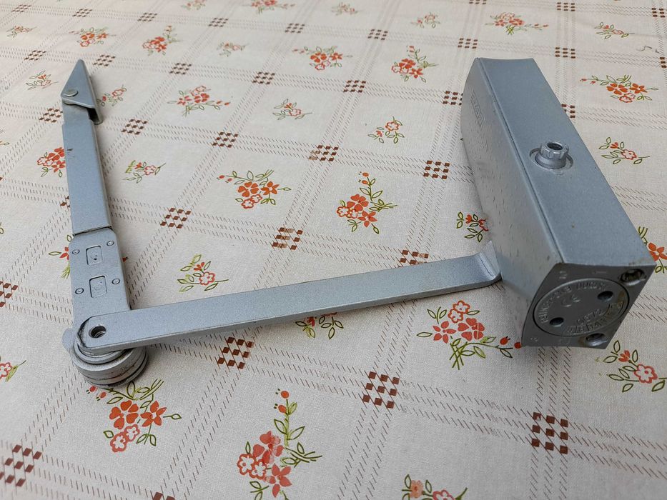 Mola para fecho de porta automático