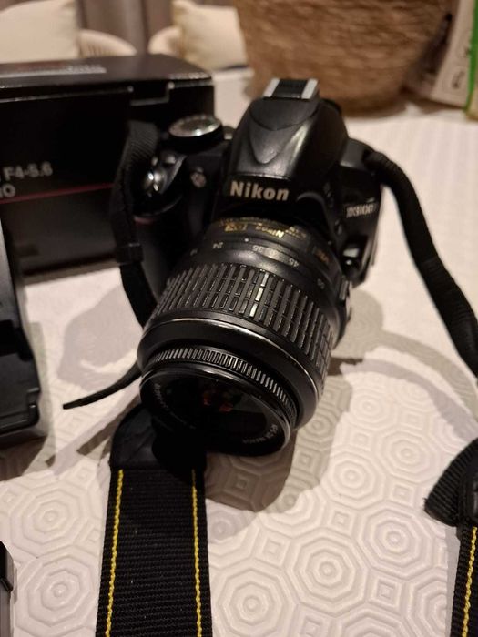 Nikon 3100D com objetiva 18.35mm e carregador64585688672129123