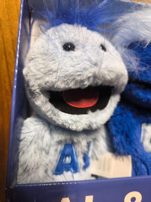 Peluche Al & Di em embalagem original.

- Peluche azul claro