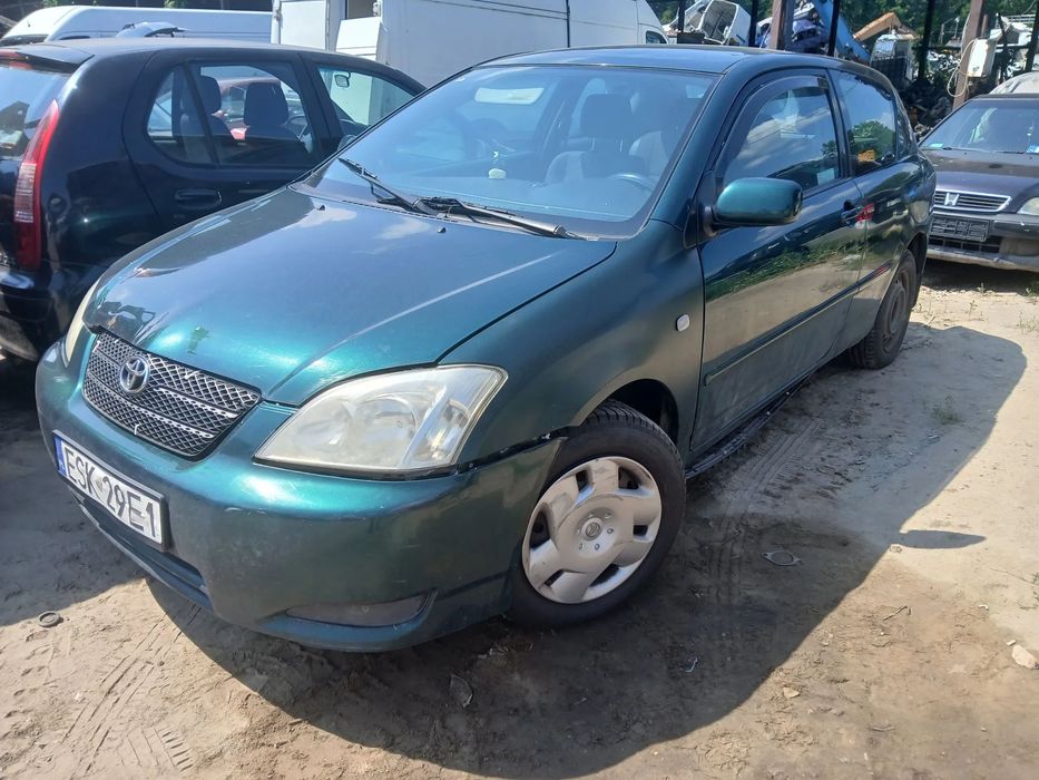 TOYOTA COROLLA HB e12 1.4 4ZZFE MTM  6R4 maska pokrywa silnika klapa bagażnika zderzak lampa reflektor pas przedni stop lampy halogeny przeciwmgłowe odblaski grill atrapa znaczek błotnik błotniki