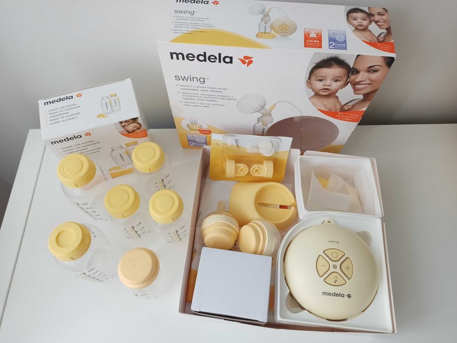 Laktator medela swing + butelki