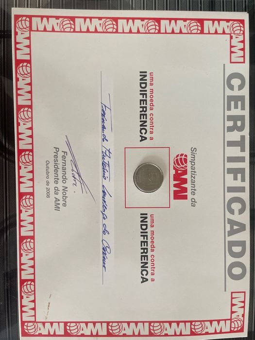 Moeda Comemorativa AMI 2002 – “Uma Moeda Contra a Indiferença” – Certificado Original