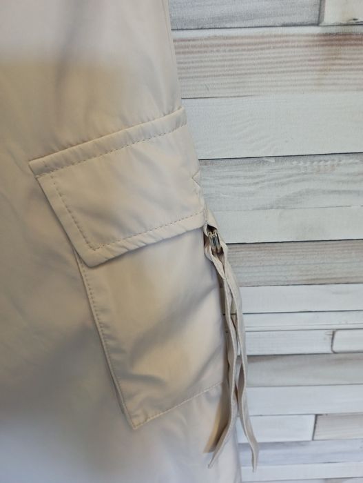 Spodnie damskie beżowe śliski materiał