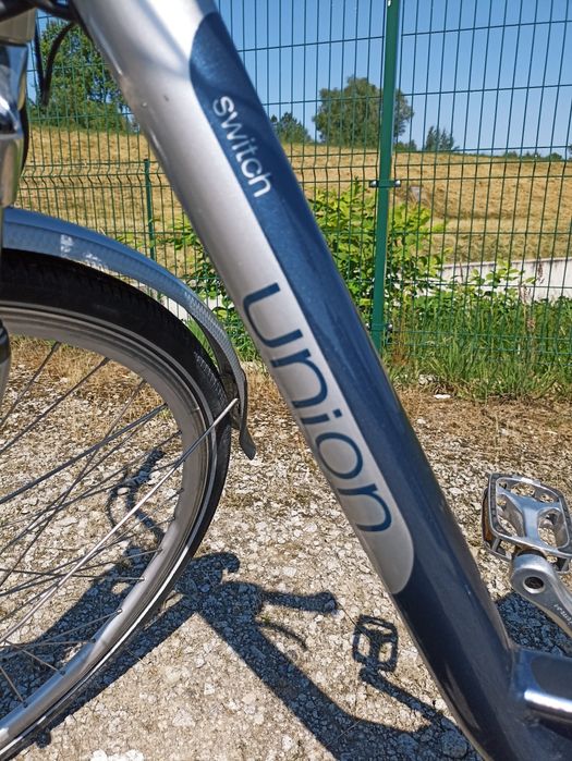 Rower elektryczny union switch z ładowarką i torbą