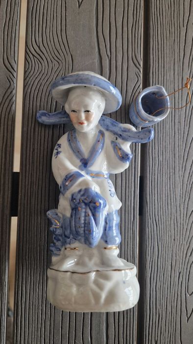 Estatueta mulher do campo asiática