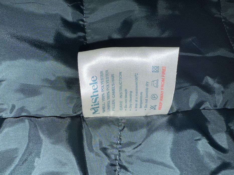 Шикарна подовжена куртка з натуральним хутром