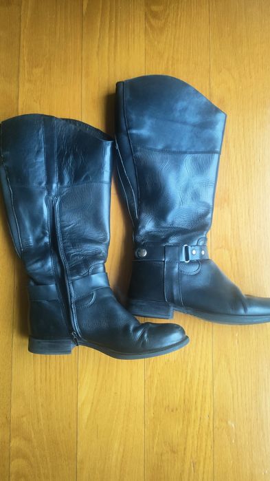 Botas cano alto. Pele